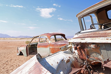 Rusty old cars corroding in the desert in namibia