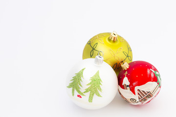 Beautiful white, red and green christmas balls on white background.