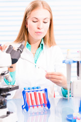 Fototapeta premium A nurse in a hospital laboratory tests a blood