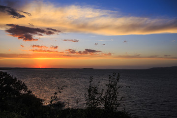 Fototapeta na wymiar Sunset at lake Trasimeno in Umbria in Italy