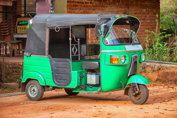 Small car with three wheels. Asian taxi tuk-tuk