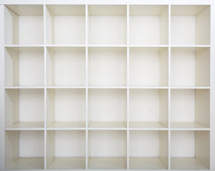 Empty bookshelf. White shelving