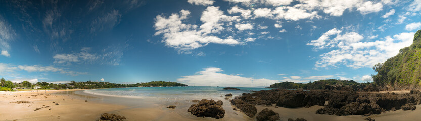 Fototapeta na wymiar Panorama of sand beach and blue sea