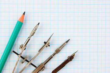 Old drawing tools on graph paper