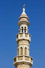 Fototapeta na wymiar minaret on a sky background