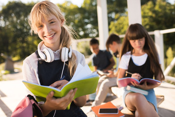 happy teenage schoolgirls