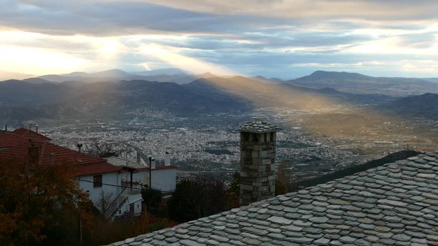 Sun shining over the city Volos in Greece
