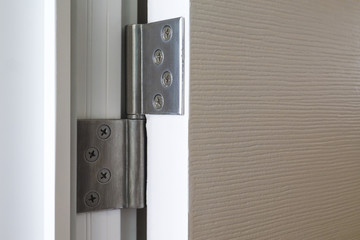 stainless door hinges on wooden swing door
