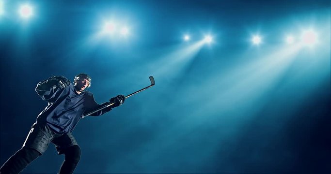 Ice Hockey player is happy on a dark background