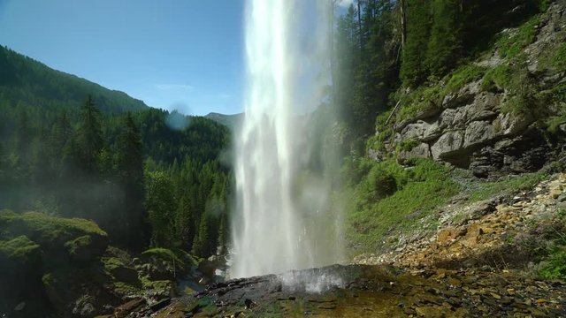 4k nature video behind waterfall on sunny summer day in mountains and forest with audio
