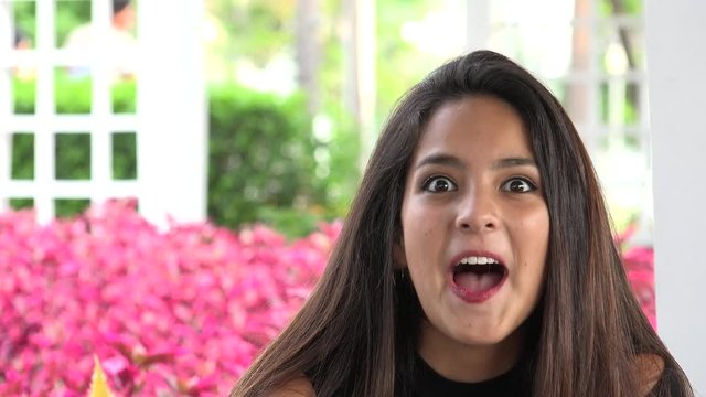 Teen Girl Blowing A Kiss And Winking