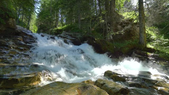 4k nature video waterfall and river over wet stones in forest loop with audio
