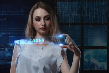 The concept of business, technology, the Internet and the network. A young entrepreneur working on a virtual screen of the future and sees the inscription: Taxes