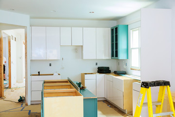 Installation of kitchen cabinet.