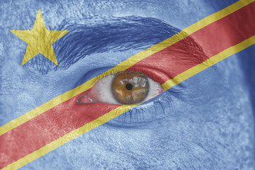 Human face and eye painted with flag of Congo
