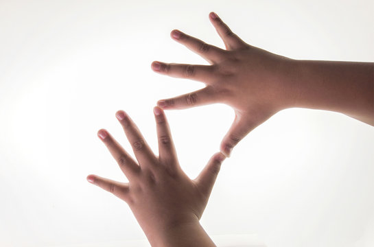 The right and left hand of a boy. Spread both fingers On a white backdrop