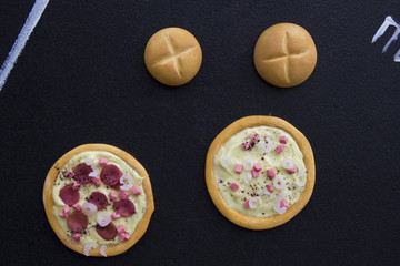 pizza toy on a black chalkboard