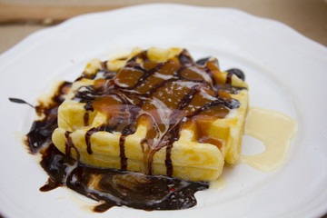 Belgian waffle with ice cream, chocolate and mint
