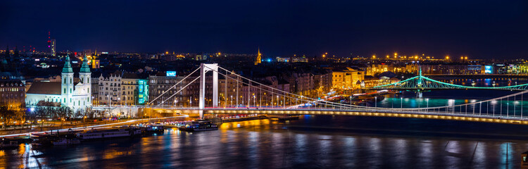 Fototapeta na wymiar Aerial view of Budapest, Hungary at night. Illuminated Liberty bridge