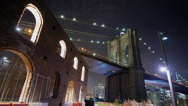 Brooklyn Bridge and warehouse at night