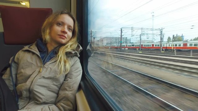tired young woman is sitting in wagon train, close up