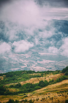 View of mountains Babadag in the clouds and a river Girdimanchay Lahij yolu from the side in Lahic village, Azerbaijan