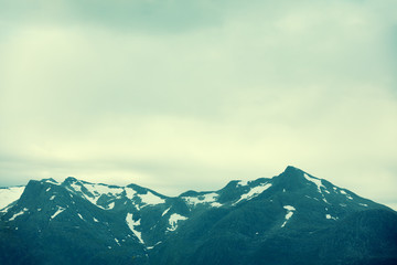 Naklejka premium Tops of mountains with glaciers. The beautiful nature of Norway
