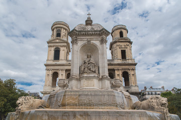 Fototapeta na wymiar Paris, place Saint-Sulpice, the fountain and the church behind