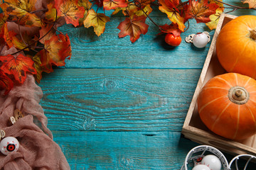 Wooden table with halloween pumpkin