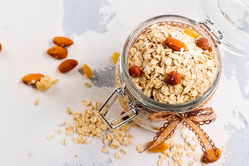Oat meal in a glass jar. Healthy eating or breakfast concept. Copy space