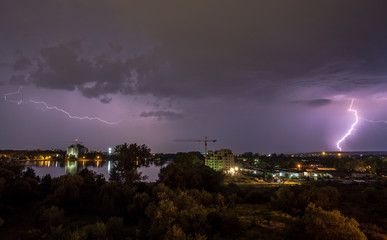 thunder and lightning storm at night in the village