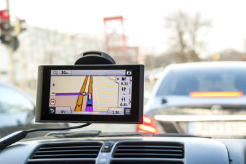 Close-up of gps navigation system device in travelling car