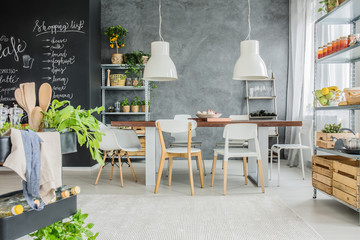 Industrial table and chalkboard wall