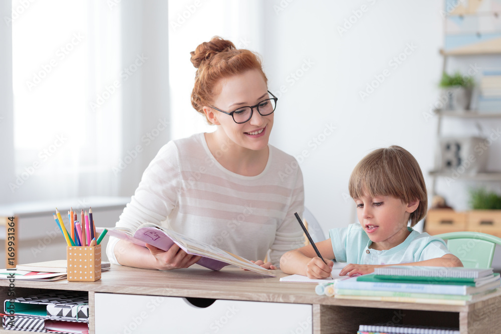 Poster smiling mother helping son