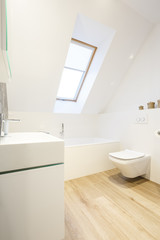 Fototapeta na wymiar White bathroom with wooden floor