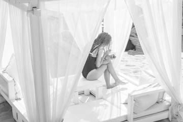 Girl in baldachin on beach - black and white, summer, sun, relaxing, fun, smile, vacation