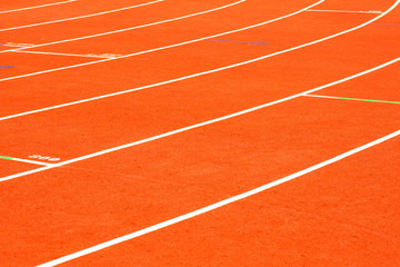 Fototapeta premium red running track on athletic stadium