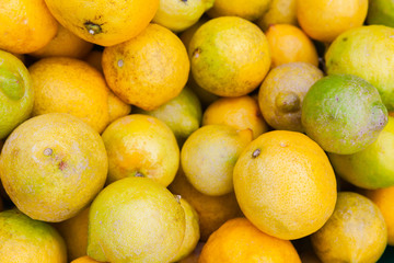 Fresh lemons lay on the counter of food market