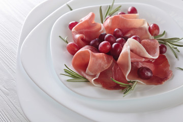 Jamon serrano with rosemary and grape .