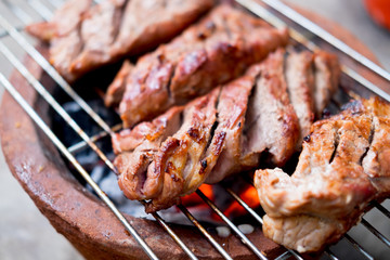 Grilled pork on charcoal stove