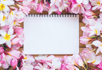 blank paper with flower on table