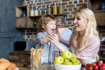 happy mother and son during breakfast