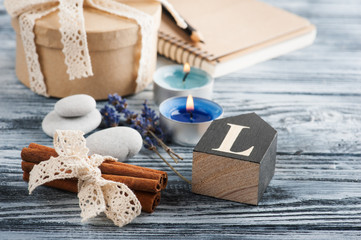 Notebook, lavender flowers, candles, pebble