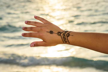  henna  tattoo painting on the  hand