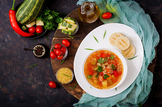 Minestrone - "big soup", soup with many ingredients - a dish of Italian cuisine, light seasonal vegetable soup with pasta.
