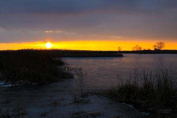 Sunset over the winter river