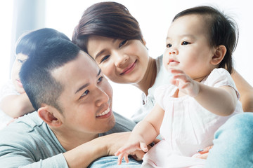 Obraz premium Young happy Asian family with kids