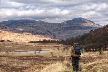 A hiker making their way along the iconic West Highland Way Scotlands oldest long distance trail
