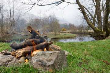 A campfire next to the river Falloch Scotland