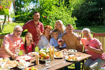 happy family having dinner or summer garden party